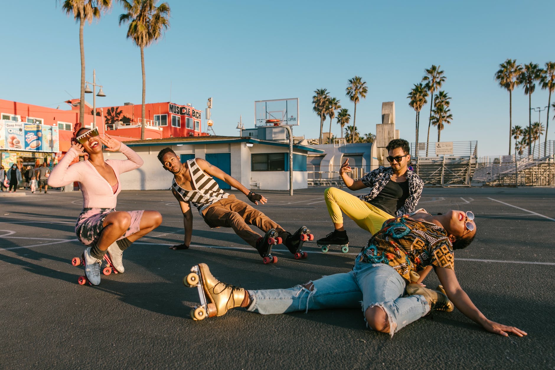 people posing while wearing roller skates